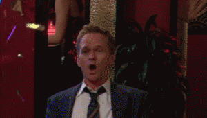 Barney Stinson being very excited with some confetti flying around