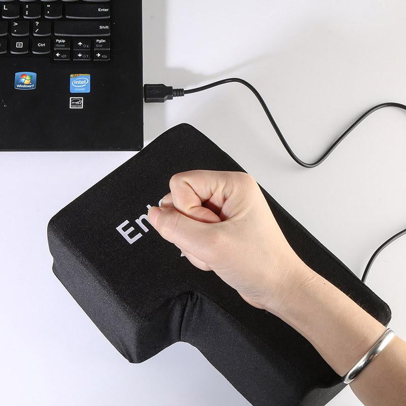 A picture of a giant "Enter"-key pillow.