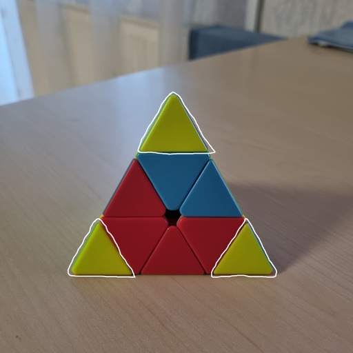 Picture of a Pyraminx where all of the yellow corners are aligned correctly.