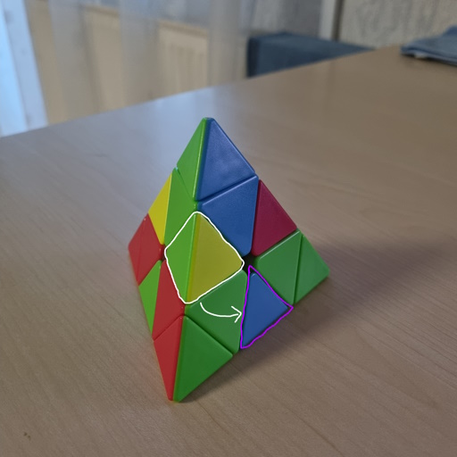 Picture of a Pyraminx right before an edge insertion showcasing the needed pattern to do a left-side insertion